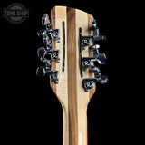 Guitar headstock with tuning pegs on a black background, featuring the Tone Shop logo.