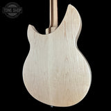 Unfinished electric guitar body on a black background with 'Tone Shop' logo.