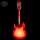 Red electric guitar on a black background with 'Tone Shop' logo.