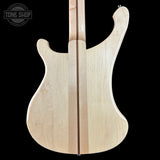 Unfinished electric guitar body on a black background with 'Tone Shop' logo.