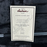 Factory certificate from Jackson Custom Shop on a dark textured background