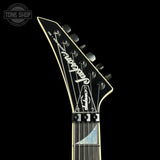 Jackson guitar headstock on a black background with 'Tone Shop' logo.