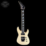Electric guitar with a clear coat finish on a black background, featuring the Tone Shop logo.
