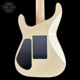 Guitar body with a cream finish and black pickguard on a black background, featuring 'Tone Shop' logo.