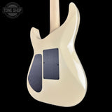 White electric guitar with a black pickguard on a black background, featuring 'Tone Shop' branding.