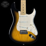 Electric guitar with a sunburst finish on a black background, featuring the Tone Shop logo.