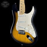 Electric guitar with a sunburst finish on a black background, featuring the Tone Shop logo.