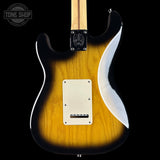 Electric guitar with a sunburst finish on a black background, featuring the Tone Shop logo.