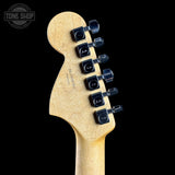 Guitar headstock with tuning pegs on a black background, featuring the Tone Shop logo.