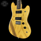 Wooden electric guitar with a black background, featuring the Tone Shop logo.