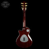 Guitar body with a visible brand logo on a black background