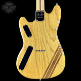 Fender electric guitar with a natural wood finish on a black background