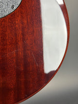 Close-up of a wooden and metal object with a reflective surface