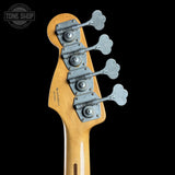 Close-up of a guitar's tuning pegs with 'Tone Shop' logo in the corner.