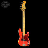 Red electric bass guitar with a black background, featuring the Tone Shop logo.