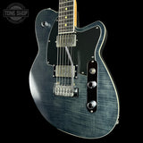 Blue electric guitar with a black background