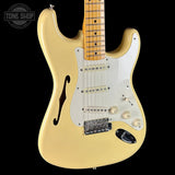 Front angle of Used 2018 Fender Eric Johnson Thinline Strat Vintage White.