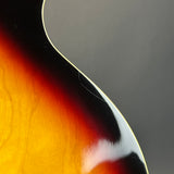 Close-up of a guitar's neck and fretboard with a gradient background