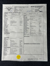 Document with text and a yellow sticker on a black background