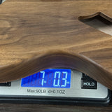 Digital scale with wooden surface displaying weight reading