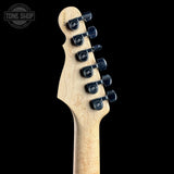 Close-up rear view of a guitar headstock with six black tuning pegs and a natural maple wood neck on a black background. A Tone Shop watermark is visible in the upper left corner.