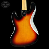 Fender electric guitar with a sunburst finish on a black background, featuring the Tone Shop logo.