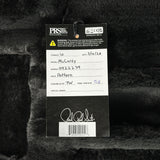 Close-up of a guitar label with detailed information on a guitar body.
