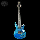 Blue electric guitar with a black background