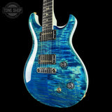 Blue electric guitar with a black background