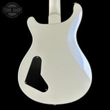 White electric guitar on a black background with 'Tone Shop' logo.