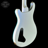 White electric guitar body on a black background with 'Tone Shop' logo.