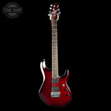 A red electric guitar with a glossy sunburst finish, shown vertically against a solid black background. The brand name 'TONE SHOP' is visible as a watermark in the top-left corner.