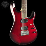 A red electric guitar with a glossy sunburst finish, featuring black hardware, a maple neck, and a chrome bridge, shown against a solid black background with a Tone Shop watermark in the top left corner.