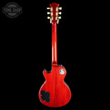 Red electric guitar on a black background with 'Tone Shop' logo.