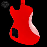 Red electric guitar body on a black background with 'Tone Shop' logo.
