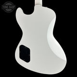 White electric guitar body on a black background with 'Tone Shop' logo.