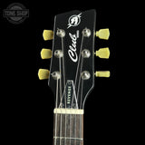 Guitar headstock with 'Club' branding on a black background