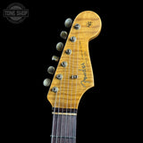 Guitar headstock with Fender logo on a black background