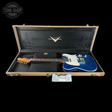 Blue electric guitar in a Fender case with 'Tone Shop' logo.