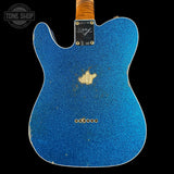 Blue glitter electric guitar with Fender logo on a black background