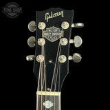 Gibson Les Paul guitar headstock with Harley-Davidson logo on a black background