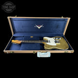 Gold glitter electric guitar in a Fender case with 'Tone Shop' logo.