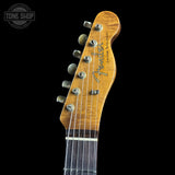 Fender guitar headstock with brand logo on a black background