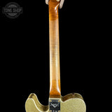 Close-up of a guitar's neck and body with a black background