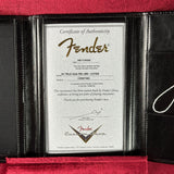 Fender certificate of authenticity in a black frame on a red background