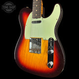Electric guitar with a sunburst finish on a black background, featuring the Tone Shop logo.