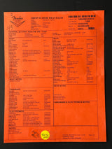 Orange label with text and barcodes on a black background