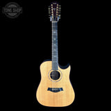 Acoustic guitar with 12 strings on a black background, featuring the Tone Shop logo.