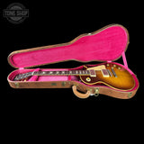 Gibson guitar in a pink case with 'Tone Shop' logo.