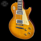 Electric guitar with a sunburst finish on a black background, featuring the Tone Shop logo.
